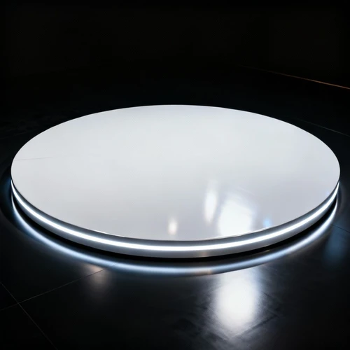 圆形旋转汽车展台，高光白色材质，边缘发光，黑色背景，俯视拍摄，反光强烈